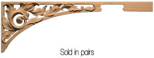 Set of two arabesque-inspired corner appliques combining detailed scrollwork and balanced white space.