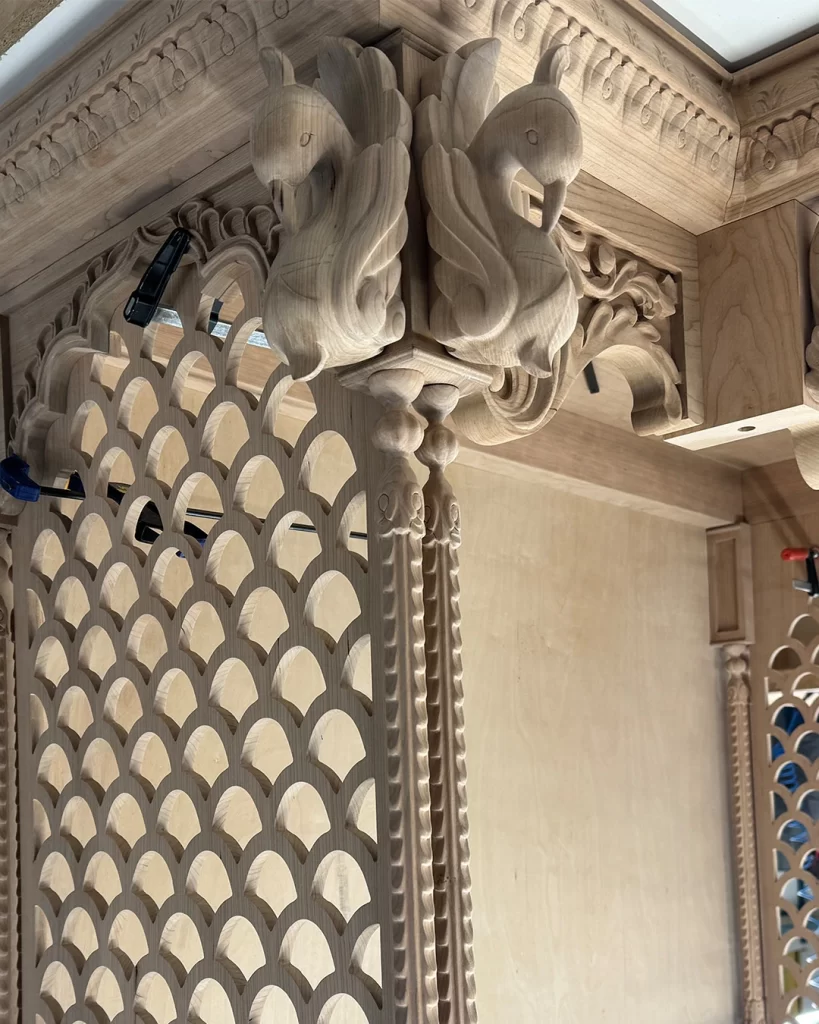 Hand-carved custom wooden Pooja Ghar with intricate Indian-inspired details and fine craftsmanship