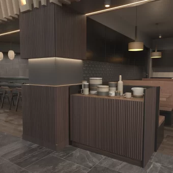 A high-end bar and reception area featuring counters and vertical columns entirely wrapped in premium dark wood tambour panels manufactured by Art for Everyday, the primary tambour manufacturer in North America.