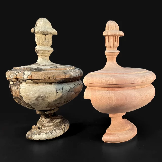 Side-by-side comparison of a weathered original antique urn and a fresh, custom-carved wooden replication, showcasing master-level woodturning and finial detail.