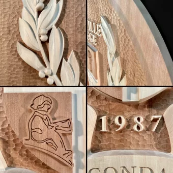 A collection of close-up details showing custom wood fabrication for university signage and heritage projects, including the year "1987" and religious iconography carved into solid wood.