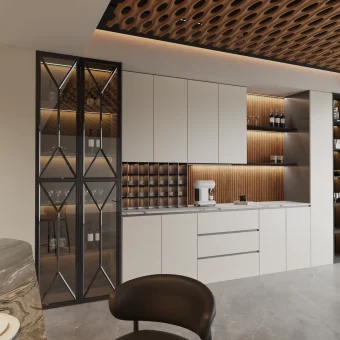 A modern kitchen display showing glass-front upper cabinets with intricate solid wood mullion inserts. The one-piece joinery creates a seamless, elegant geometric pattern across the glass.